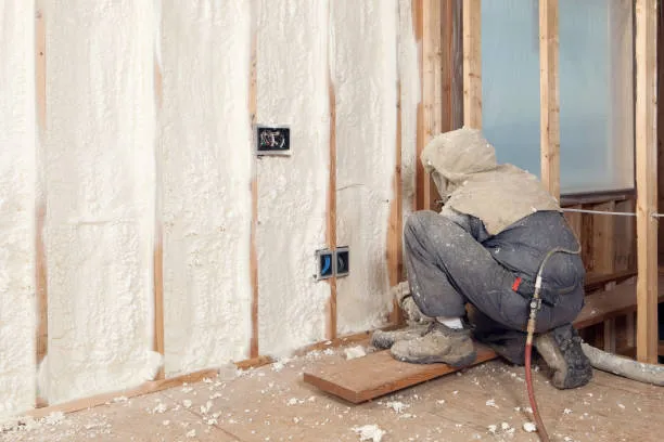 spray foam insulation nyc queens ny worker in grey